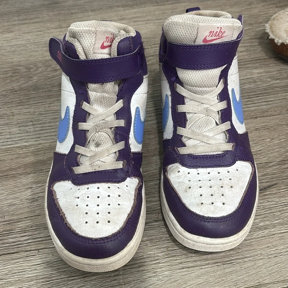 Nike girls high top sneakers. Used but still have life left to them! Size 1.5